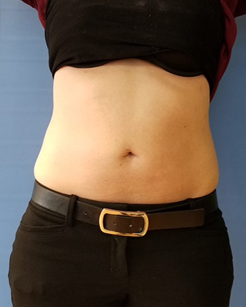 Bare midriff of a person wearing black pants and a belt, with a black shirt above
